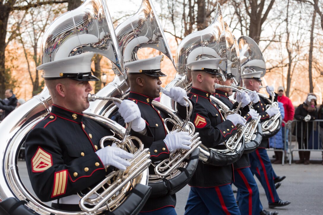 The Tuba Section, East Coast Marine Corps Combined Band marches the 2.5 miles trek through the streets of New York in the Macy's Thanksgiving Day Parade on Nov. 28, 2013. Comprised of 80 instrumentalists from the Marine Corps’ three largest east coast installations; Marine Corps Base Quantico, Va., Camp Lejeune, N.C., and Marine Corps Air Station Cherry Point, N. C., the Marines participated for only the second time in the parades 89 year history. 