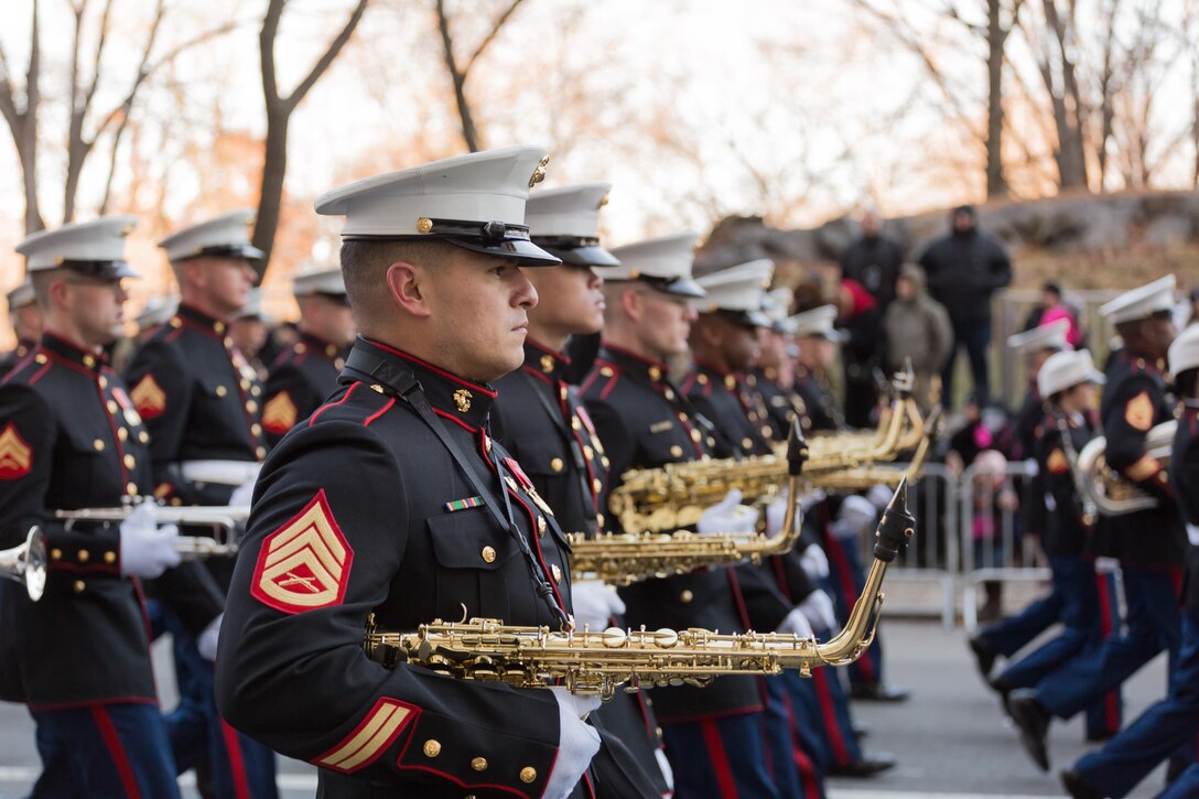The saxophone section, East Coast Marine Corps Combined Band marches the 2.5 miles trek through the streets of New York in the Macy's Thanksgiving Day Parade on Nov. 28, 2013. Comprised of 80 instrumentalists from the Marine Corps’ three largest east coast installations; Marine Corps Base Quantico, Va., Camp Lejeune, N.C., and Marine Corps Air Station Cherry Point, N. C., the Marines participated for only the second time in the parades 89 year history. 