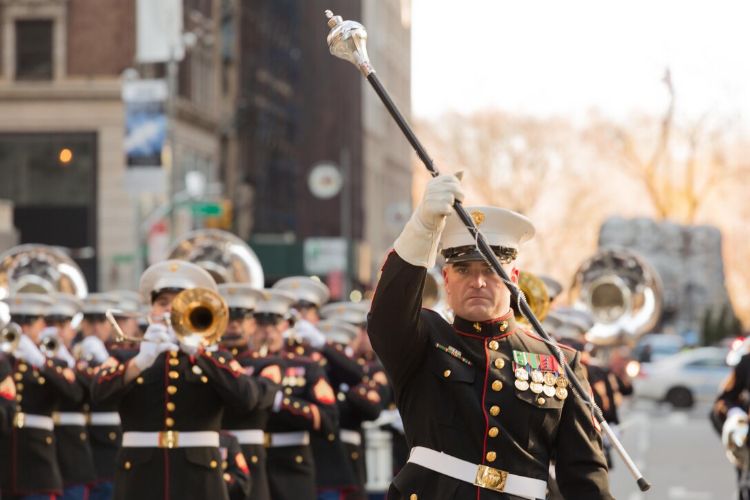Staff Sgt. Mark Bender leads the East Coast Marine Corps Combined Band 2.5 miles through the streets of New York in the Macy's Thanksgiving Day Parade on Nov. 28, 2013. Comprised of 80 instrumentalists from the Marine Corps’ three largest east coast installations; Marine Corps Base Quantico, Va., Camp Lejeune, N.C., and Marine Corps Air Station Cherry Point, N. C., the Marines participated for only the second time in the parades 89 year history