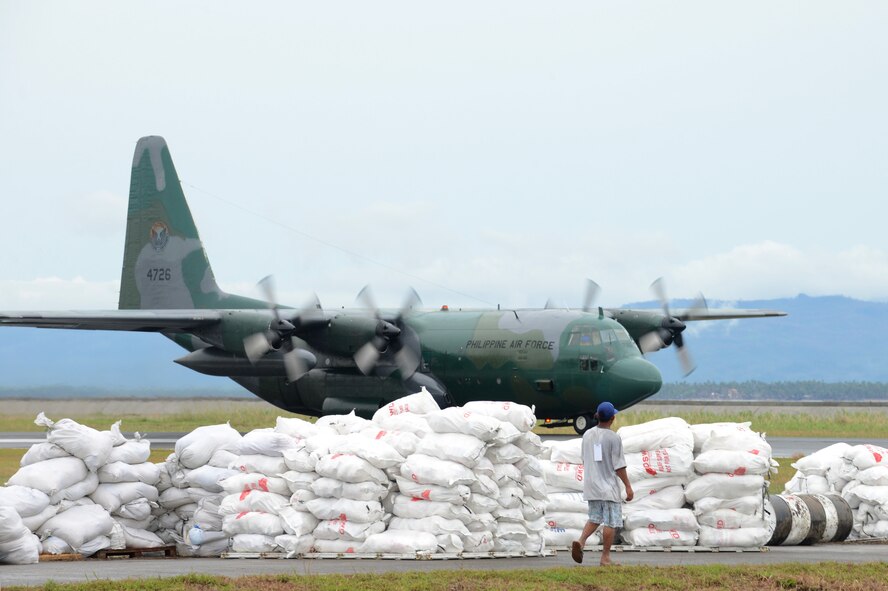 A Philippine Air Force C-130 lands at Tacloban Airport to deliver relief supplies in support of Operation Damayan, Nov. 23, 2013. (U.S. Air Force photo by 2nd Lt. Jake Bailey/Released)
