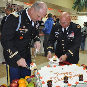 U.S. Army Col. Thomas Boccardi, Joint Task Force-Bravo Commander, and U.S. Army Col. John Sena, Army Support Activity Commander, cut slices of a cake to serve to members of Joint Task Force-Bravo during a Thanksgiving Day meal served at the dining facility at Soto Cano Air Base, Honduras, Nov. 28, 2013. Joint Task Force-Bravo members were treated to a Thanksgiving Day meal with all the trimmings in celebration of the holiday.  Joint Task Force-Bravo leadership, as well as leaders from the Army Support Activity, Army Forces Battalion, Joint Security Forces, 612th Air Base Squadron, 1-228th Aviation Regiment, and Medical Element wore their dress uniforms and served the members of the Task Force. (U.S. Air Force photo by Capt. Zach Anderson)
 