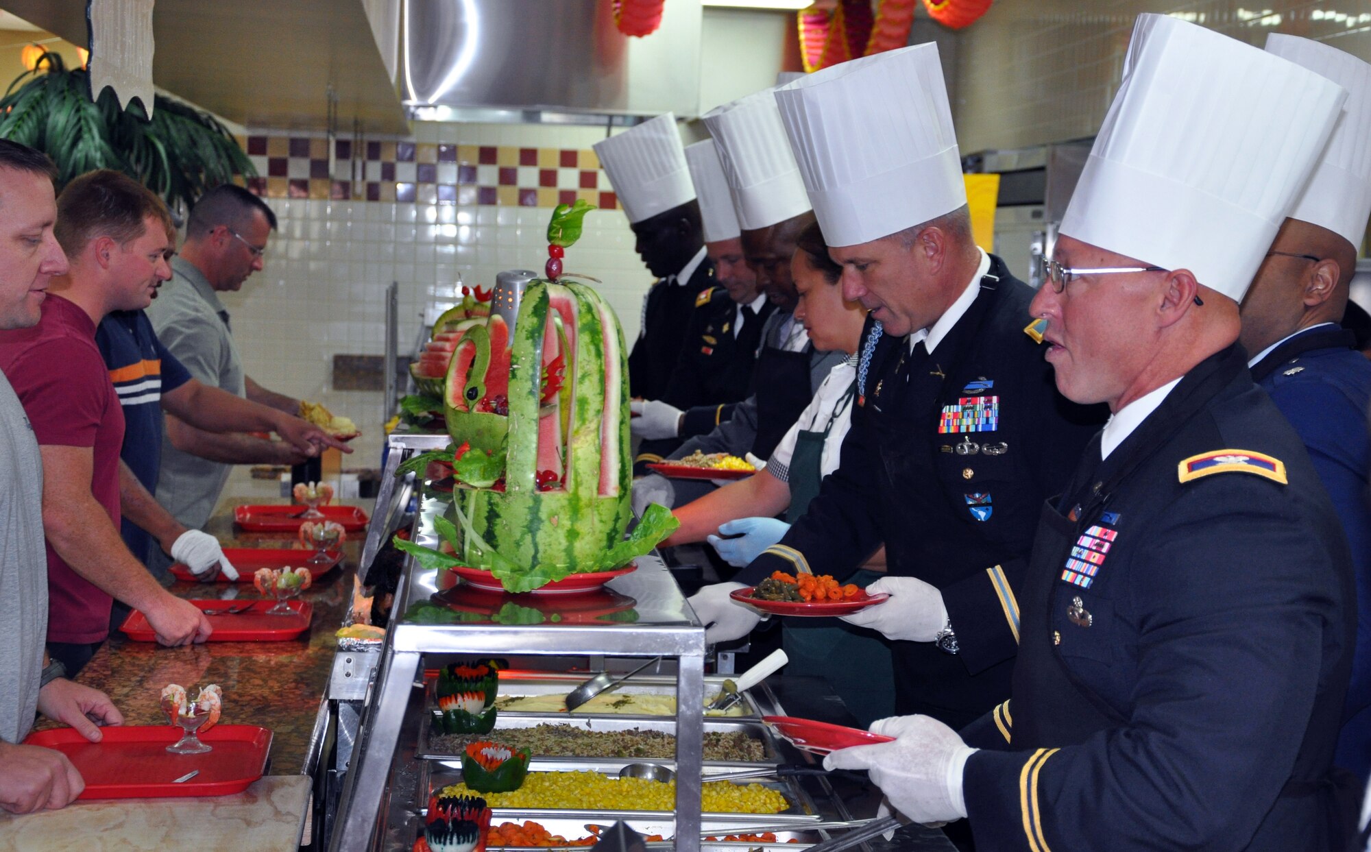 Members of Joint Task Force-Bravo were treated to a Thanksgiving Day meal with all the trimmings at the dining facility at Soto Cano Air Base, Honduras, Nov. 28, 2013. Joint Task Force-Bravo leadership, as well as leaders from the Army Support Activity, Army Forces Battalion, Joint Security Forces, 612th Air Base Squadron, 1-228th Aviation Regiment, and Medical Element wore their dress uniforms and served the members of the Task Force. (U.S. Air Force photo by Capt. Zach Anderson)
 