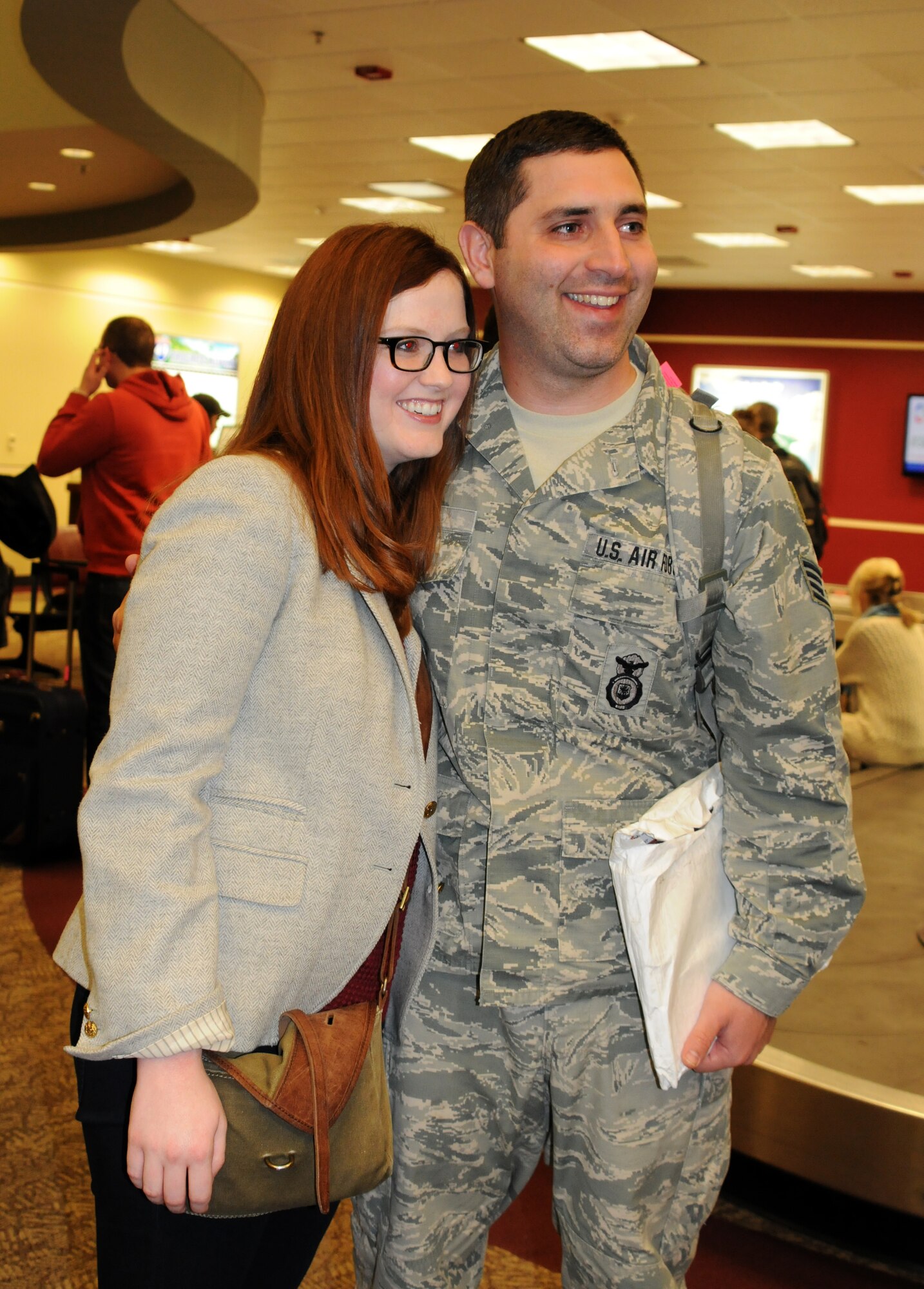 Staff Sgt. Peter Hilton reunites with his family at the Fort Smith (Ark.) Regional Airport Nov. 27, 2013, following a six-month deployment to the Middle East. Hilton was one of 13 Airmen with the 188th Security Forces Squadron who returned just in time to spend the Thanksgiving holiday with his family. (U.S. Air National Guard photo by Maj. Heath Allen/188th Fighter Wing)