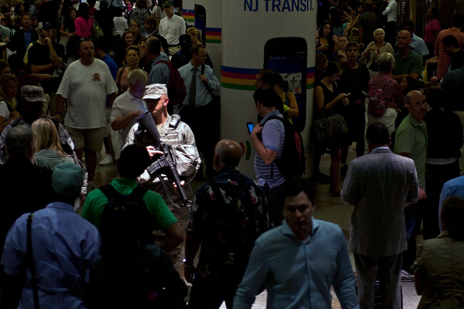 Airmen 1st Class Peter Grajewski, with the New York National Guard's Joint Task Force Empire Shield, provides a security presence through the New Jersey Transit train platform during the evening commuter surge.