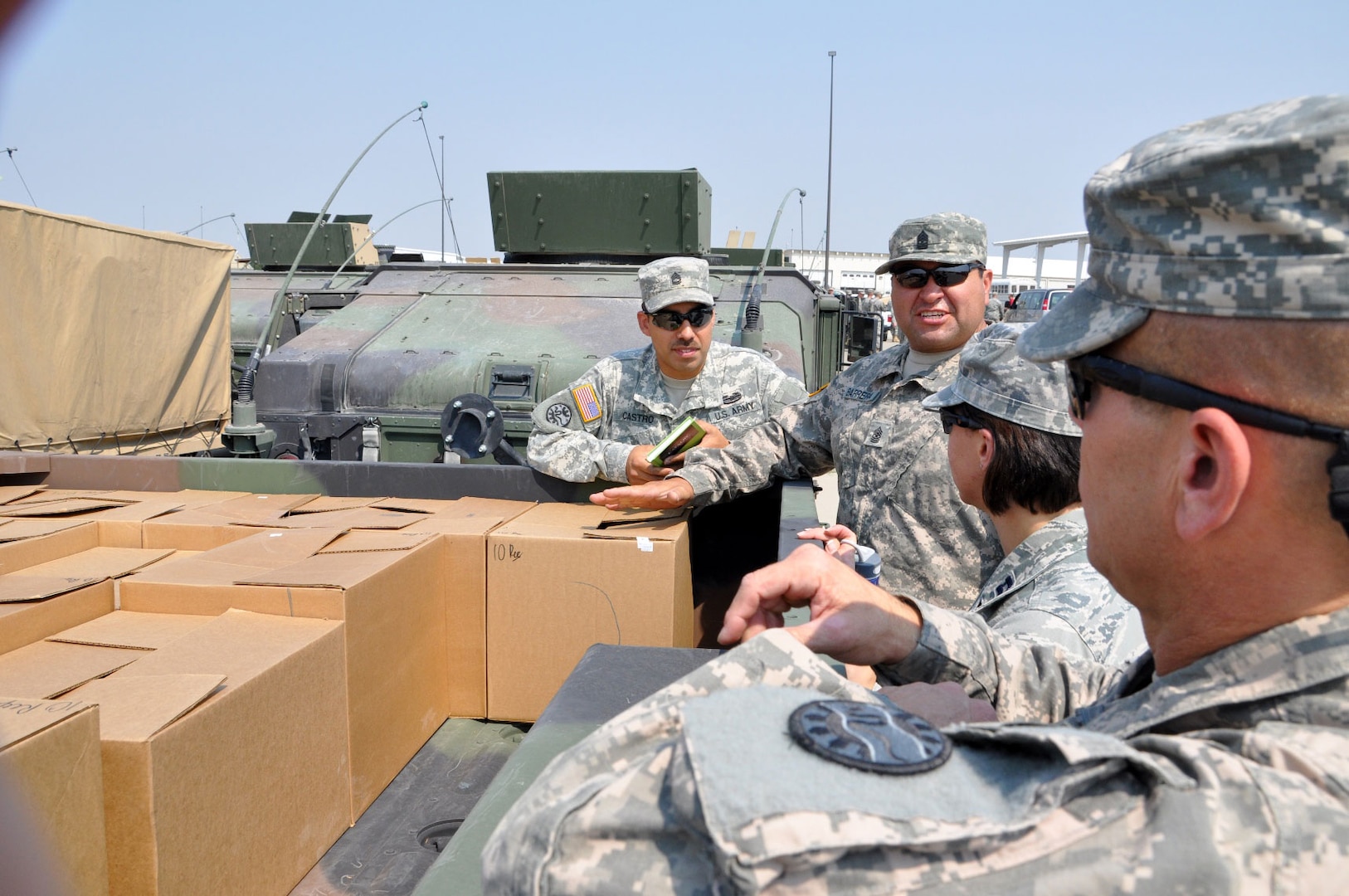 Idaho National Guard members prepare their assigned vehicle prior to heading out from Gowen Field, Idaho, in support of ongoing wildfire suppression efforts to extinguish the Trinity Wildfire. More than 100 Soldiers and Airmen of the Idaho Guard have been called out to support the battle against the Trinity Wildfire and will be performing security, medical evacuation and aerial firefighting roles.