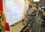 Master Sgt. James Kersey (left) and Sgt. 1st Class Chris Brunner of the 53rd Infantry Brigade Combat Team monitor the track of Tropical Storm Isaac from the Florida National Guard's Joint Emergency Operations Center in St. Augustine, Fla., Aug. 22, 2012. The Florida National Guard was monitoring official forecasts for the storm in anticipation of the storm reaching Florida.