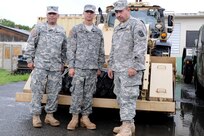 Citizen-Soldiers of the Puerto Rico National Guard are mobilized as tropical storm Isaac passes through the Caribbean. Here, U. S. Army Sgt. Javier Narváez, PV2 Christian Pérez and Spc. Israel Díaz of the 190th Engineer Battalion, Puerto Rico National Guard, all heavy equipment operators, await for instructions.