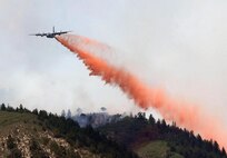 Aircrews use a C-130 Hercules aircraft equipped with the Modular Airborne Firefighting System to drop fire retardant on a section of the Waldo Canyon fire near Colorado Springs, Colo. June 26. Aircrews flying the MAFFS mission recently dropped the 2 millionth gallon of fire retardant for the season making it the third highest in MAFFS history for gallons dropped. In 1994 about 5 million gallons were dropped and in 2000 more than 2.1 million gallons were dropped.