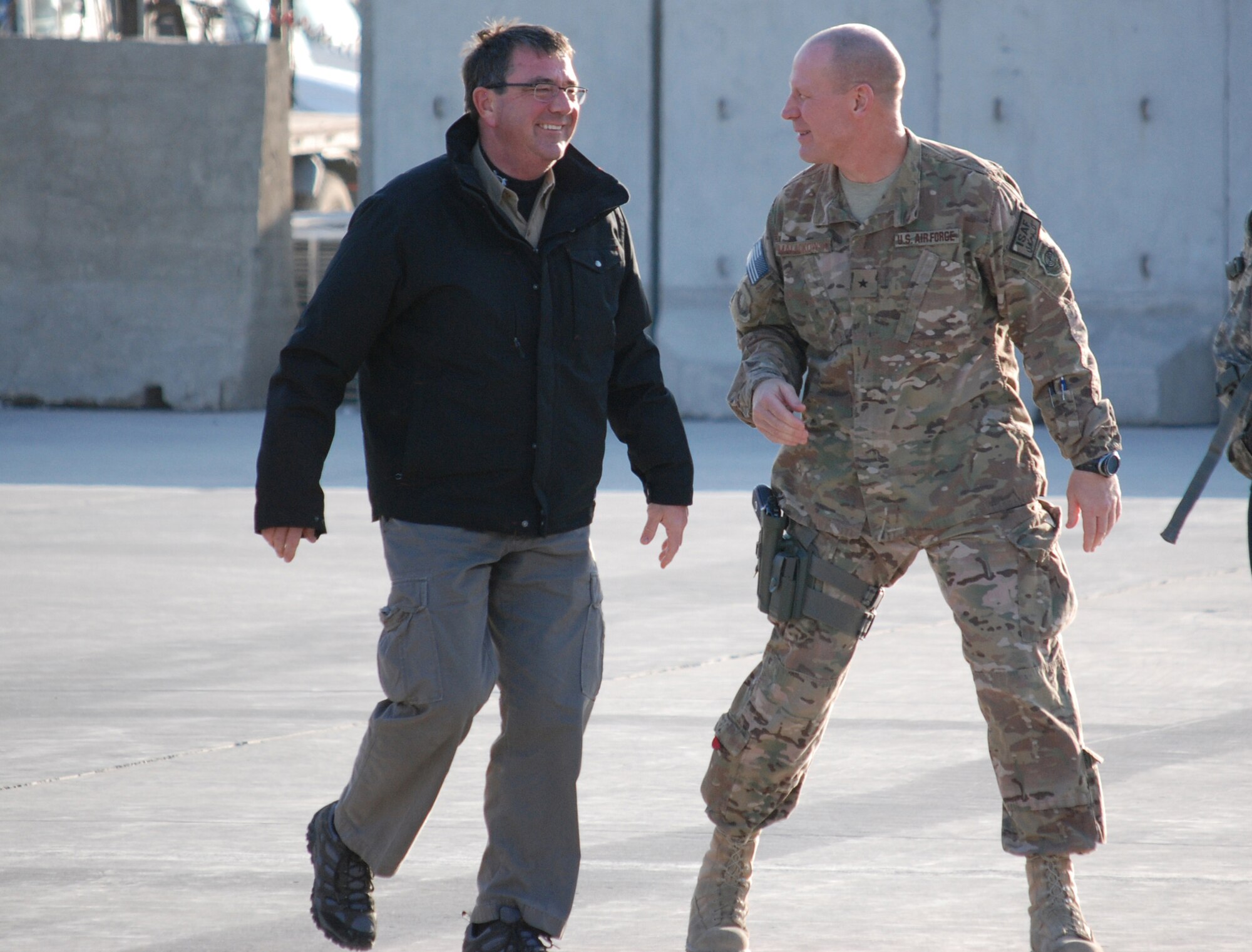 Brig. Gen. Patrick Malackowski talks to Deputy Secretary of Defense Ashton Carter as he arrives to Bagram Airfield, Afghanistan, November 28, 2013. Secretary Carter visited with wing leadership, met with patients at the Craig Joint Theater Hospital, served Thanksgiving to service members and ate dinner with Airmen. (U.S. Air Force photo by Capt. Brian Wagner)