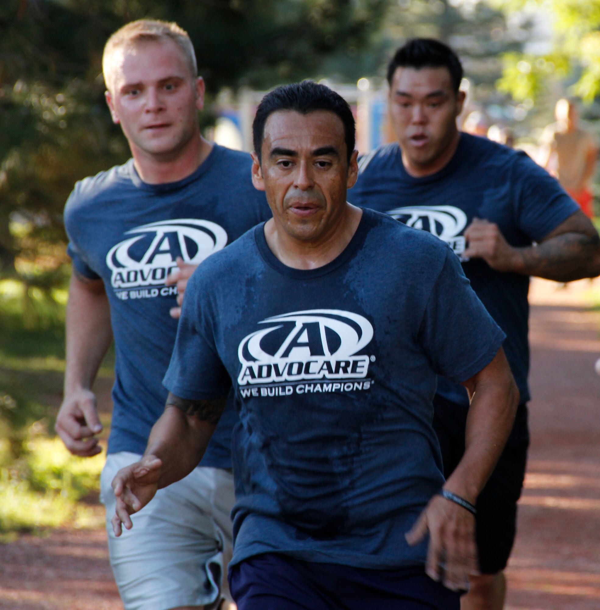 Tech. Sgt. Vic Bejarano leads his team during a 302nd Airlift Wing CrossFit challenge. His team finished first and two other teams he trains with finished in the top four. (U.S. Air Force photo/Staff Sgt. Nathan Federico)