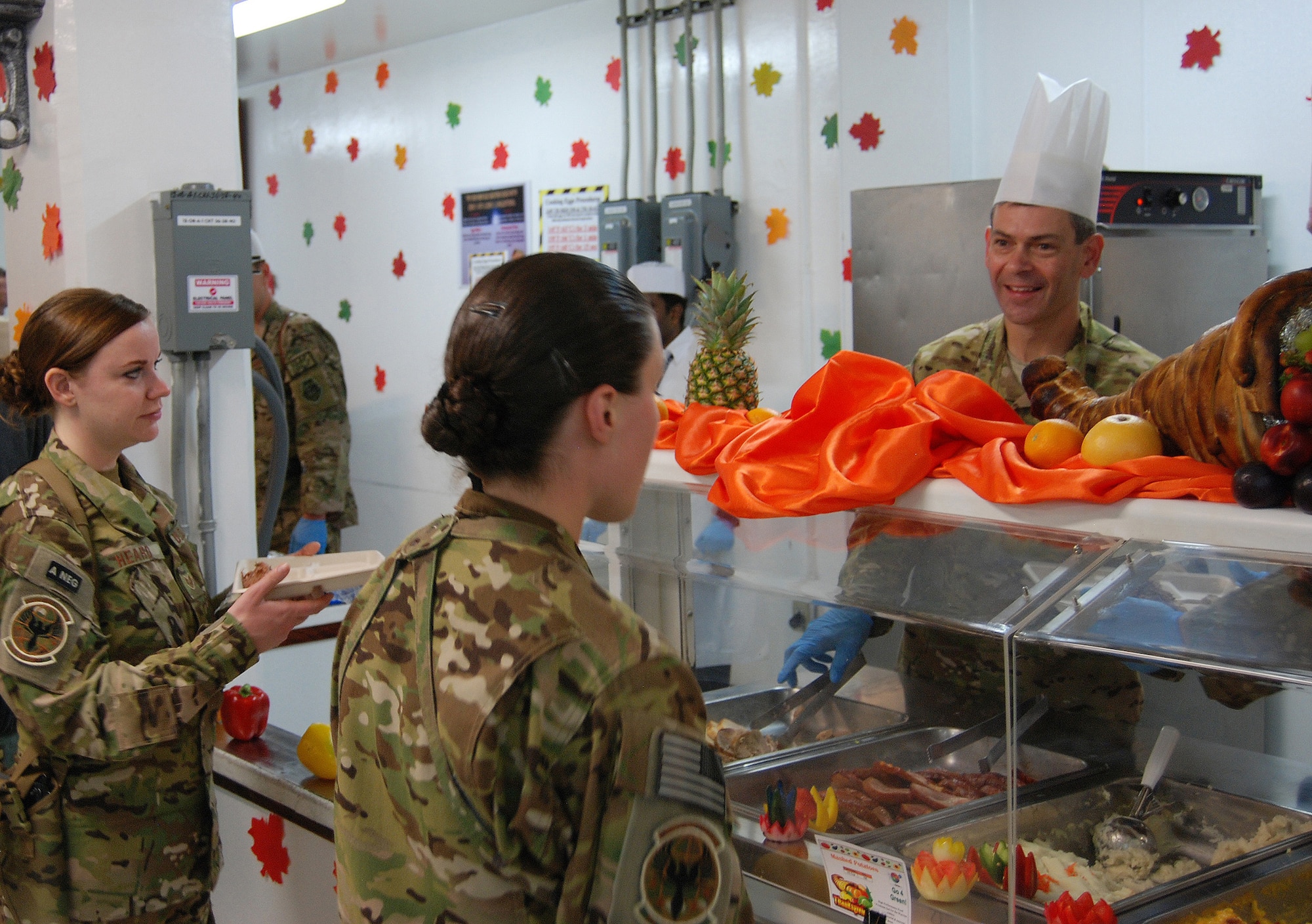 Air Force Maj. Gen. Ken Wilsbach, 9th Air and Space Expeditionary Task Force- Afghanistan; Deputy Commander-Air, U.S. Forces-Afghanistan; and Deputy Chief of Staff-Air, International Security Assistance Force Joint Command commander serves Thanksgiving dinner to service members at the Dragon DFAC at Bagram Airfield, Afghanistan, November 28, 2013. Various senior leaders took shifts serving dinner to service members, civilians and contractors at Bagram Airfield, Afghanistan.  (U.S. Air Force Photo by Capt. Brian Wagner)