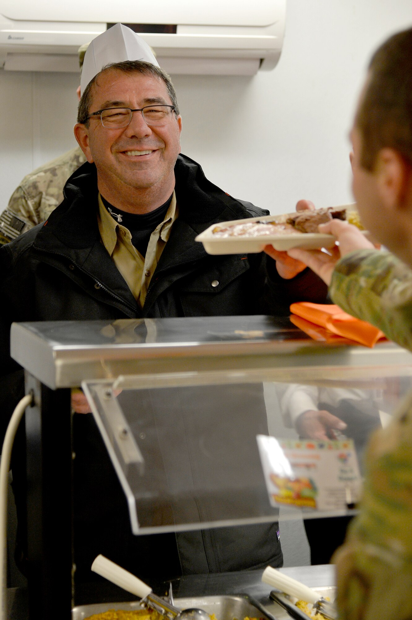 Mr. Ashton Carter, U.S. Deputy Secretary of Defense, serves Thanksgiving dinner for Service members at Bagram Airfield, Afghanistan, Nov. 28, 2013. Carter served Service members dinner before joining them for dinner himself. (U.S. Air Force photo by Senior Airman Kayla Newman)