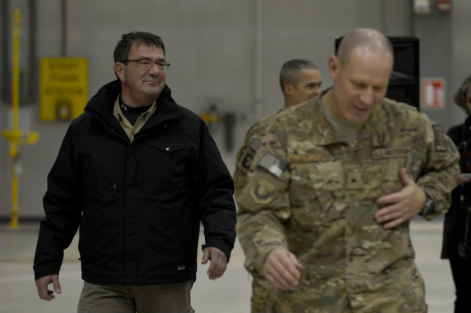 U.S. Air Force Brig. Gen. Patrick C. Malackowski, 455th Air Expeditionary wing commander, escorts Mr. Ashton Carter, U.S. Deputy Secretary of Defense, at Bagram Airfield, Afghanistan, Nov. 28, 2013. Carter spoke with Service members before serving Thanksgiving dinner at the Khoele Dining Facility. (U.S. Air Force photo by Senior Airman Kayla Newman)