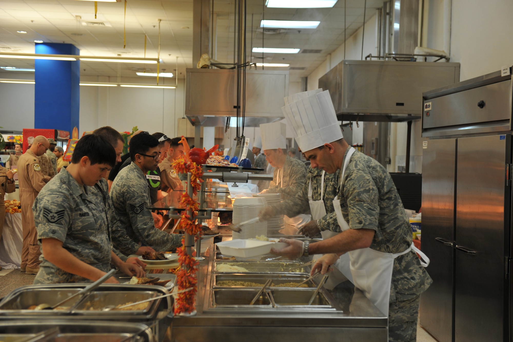 Airmen volunteers served Thanksgiving day meals to service members assigned to the 379th Air Expeditionary Wing and tenant units in Southwest Asia, on Nov. 28, 2013. (U.S. Air Force photo/Master Sgt. David Miller)