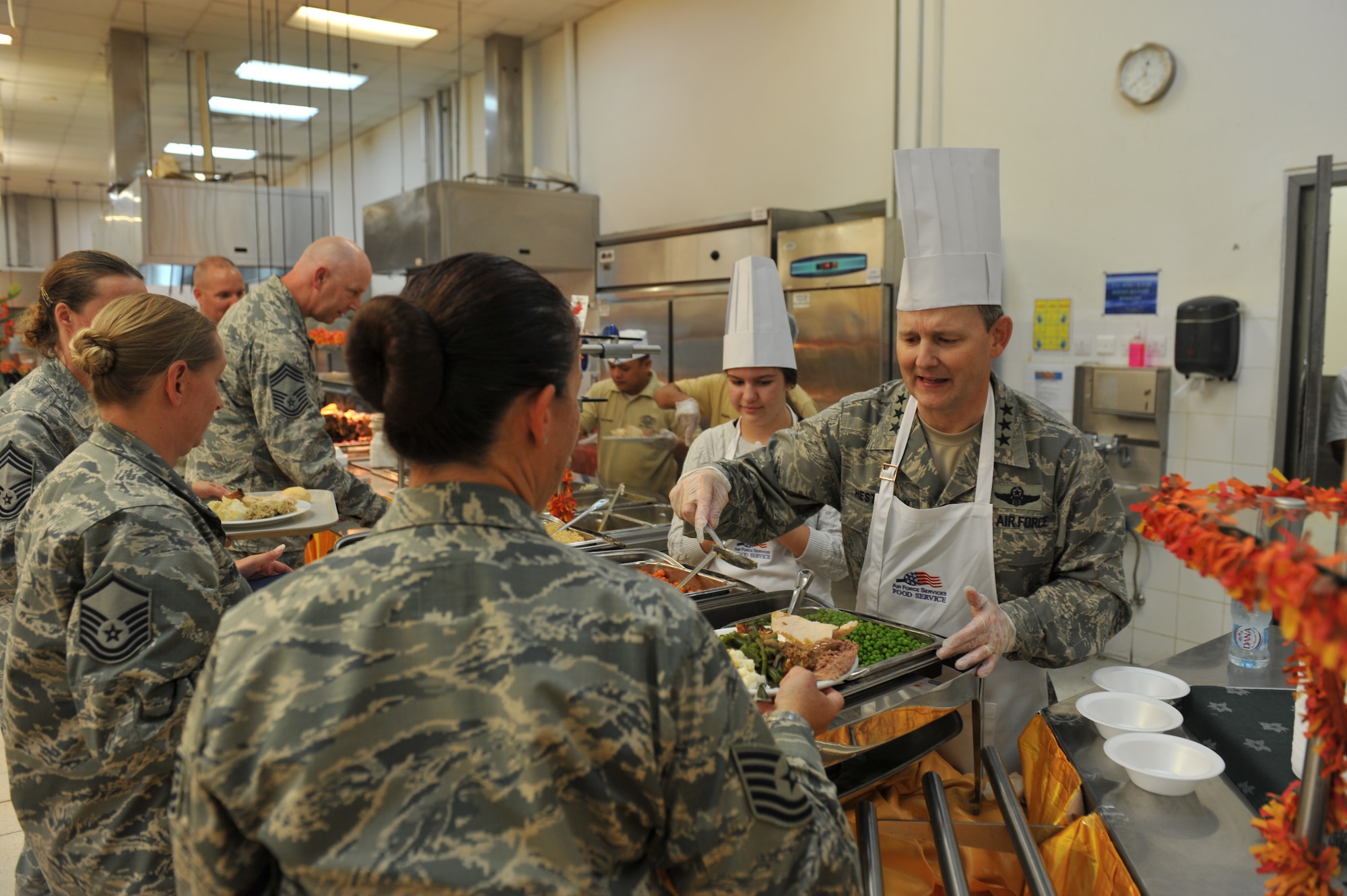 Lt. Gen. John Hesterman III, U.S. Air Forces Central Command commander serves Thanksgiving day meals to service members assigned to the 379th Air Expeditionary Wing and tenant units in Southwest Asia, on Nov. 28, 2013. (U.S. Air Force photo/Master Sgt. David Miller)