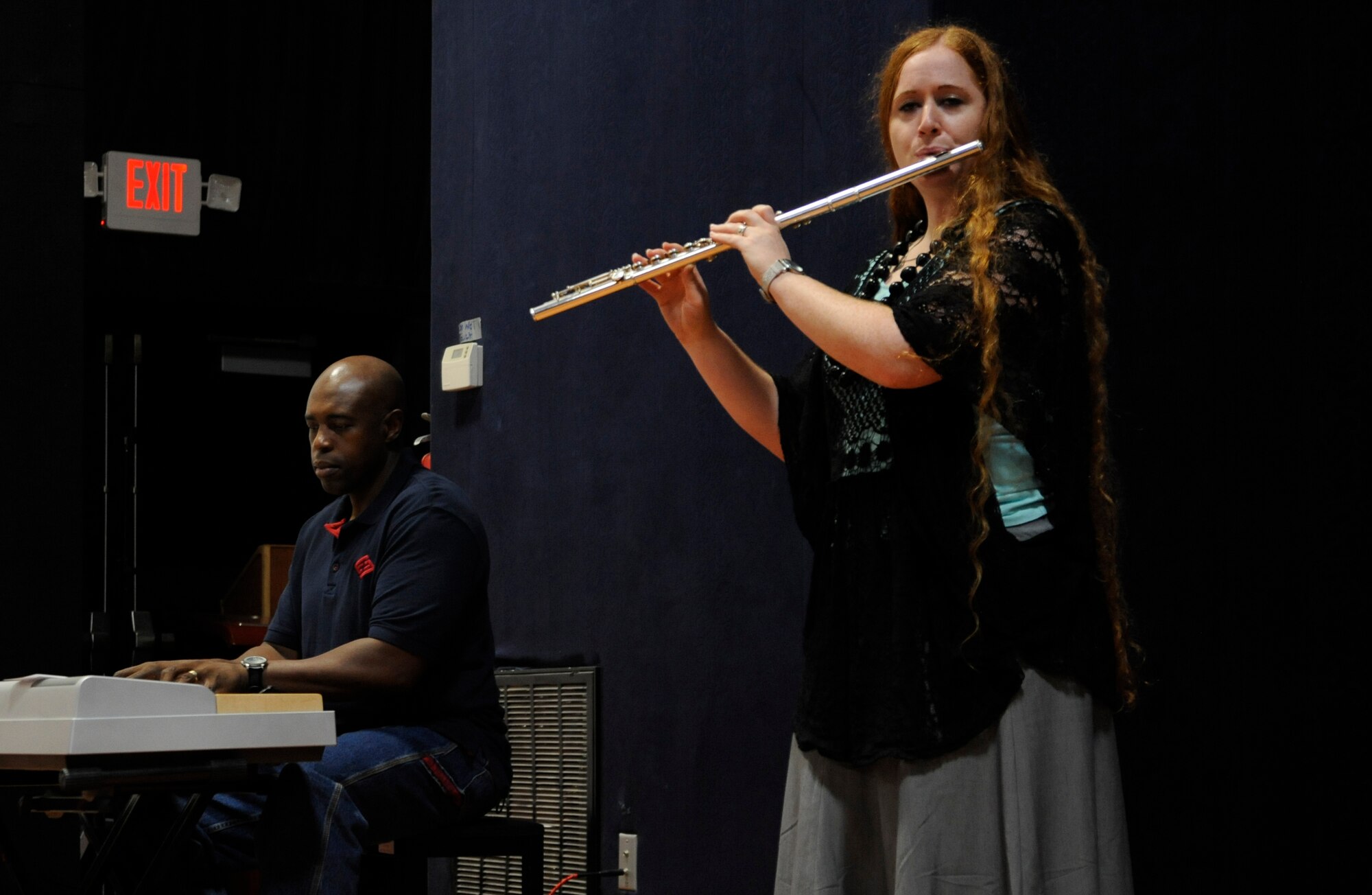 Senior Master Sgt. Stacy Fields and Tech. Sgt. Lynn Means play “America the Beautiful” while the combined Victory Chapel choir sings during the Interfaith Thanksgiving service at the 379th Air Expeditionary Wing in Southwest Asia, Nov. 28, 2013 The Victory Chapel staff put together the Thanksgiving celebration, to bring together deployed service personnel of all religious faiths. Fields is the 379th Expeditionary Comptroller Squadron superintendent deployed from Scott Air Force, Ill., and a Bastrop, La., native. Means is a 609th Air and Space Operations Center NCO in charge of targets deployed from Barksdale Air Force Base, La., and hails from Arlington, Wash. (U.S. Air Force photo/Senior Airman Bahja J. Jones) 