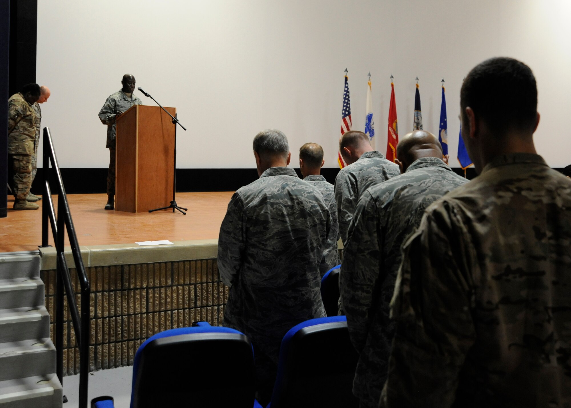Chief Master Sgt. Rory Wicks delivers the invocation during the Interfaith Thanksgiving Service at the 379th Air Expeditionary Wing in Southwest Asia, Nov. 28, 2013. The Victory Chapel staff put together the Thanksgiving celebration, to bring together deployed service personnel of all religious faiths. Wicks is the 379th AEW command chief on a two-year tour and a Kinston, N.C., native. (U.S. Air Force photo/Senior Airman Bahja J. Jones) 