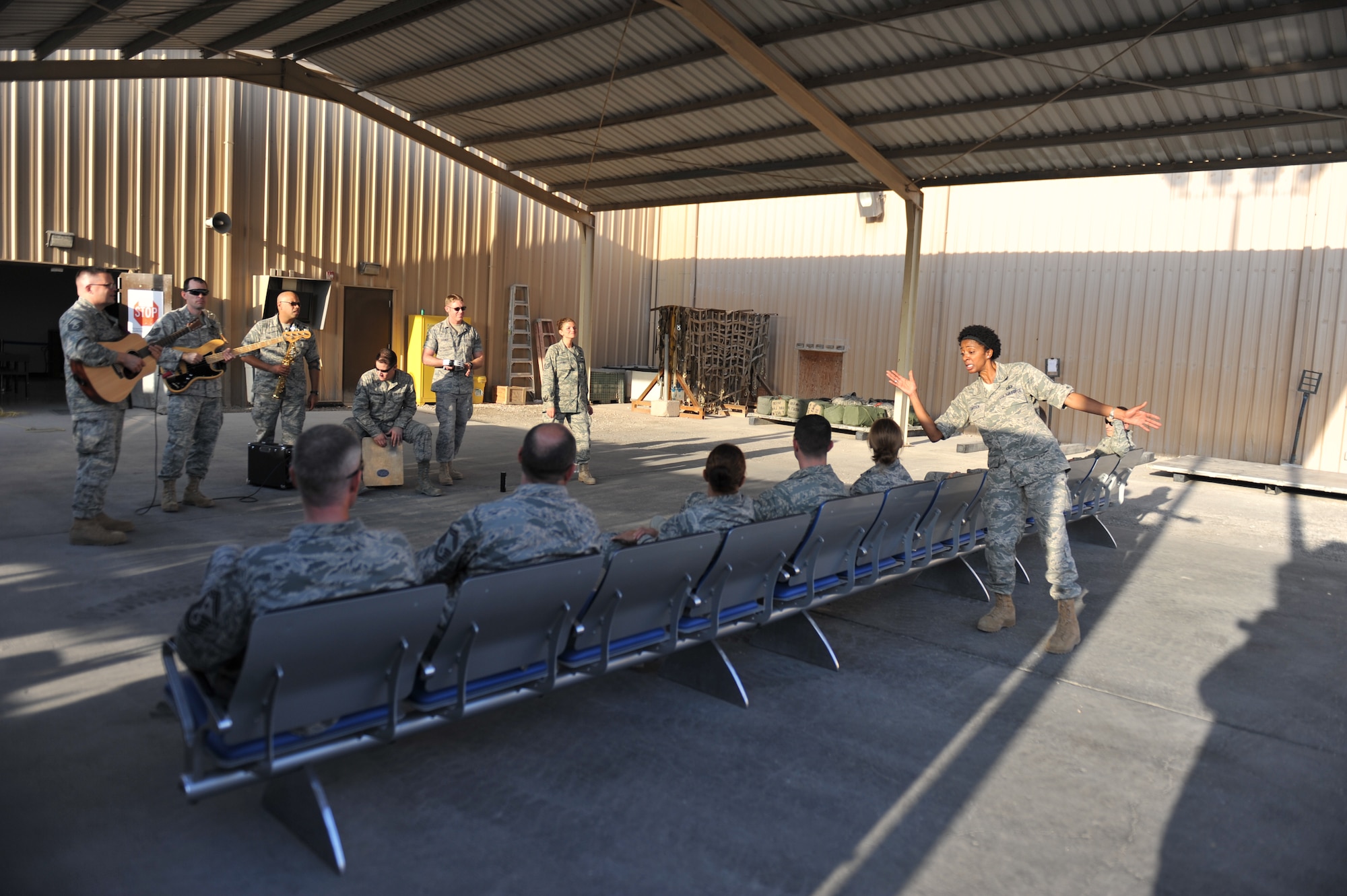 The U.S Air Forces Central Command band Systems Go performs for service members at the 8th Expeditionary Air Mobility Squadron passenger terminal, 379th Air Expeditionary Wing, Southwest Asia on Nov. 27, 2013. Systems Go is the newest AFCENT rock band and will provide performances to increase troop morale, diplomacy, and outreach to host nations. (U.S. Air Force photo/Master Sgt. David Miller)