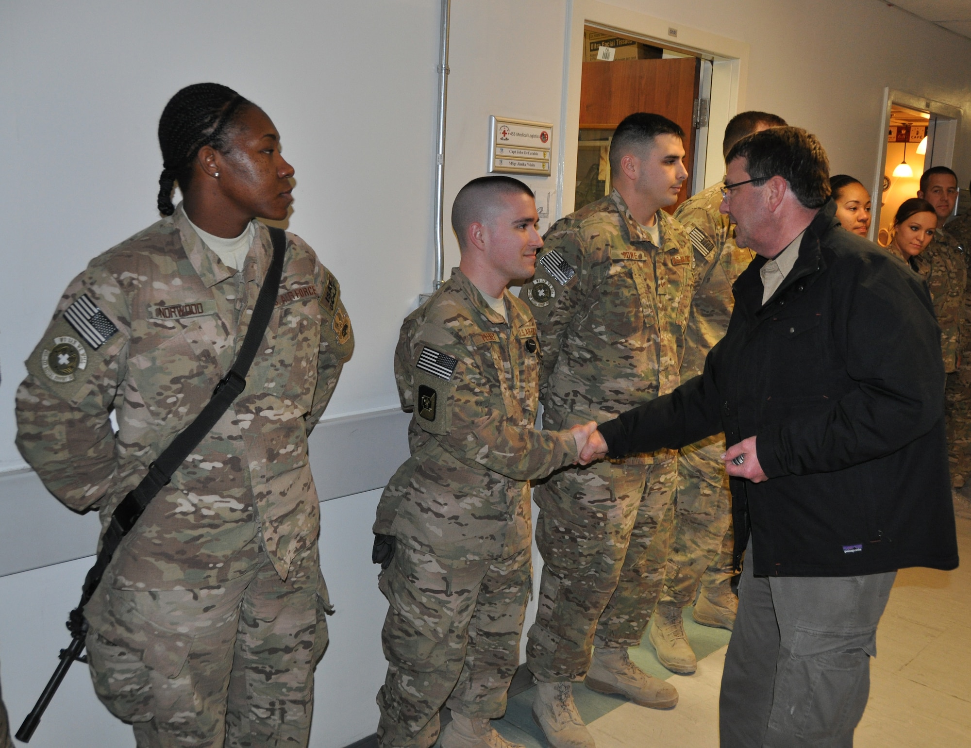 Mr. Ashton Carter, U.S. Deputy Secretary of Defense, greets a hospital staff member from the Heathe N. Craig Joint Theater Hospital during a Thanksgiving day visit at Bagram Airfield, Afghanistan, Nov. 28, 2013. (U.S. Air Force Photo/Tech. Sgt. Rob Hazelett)