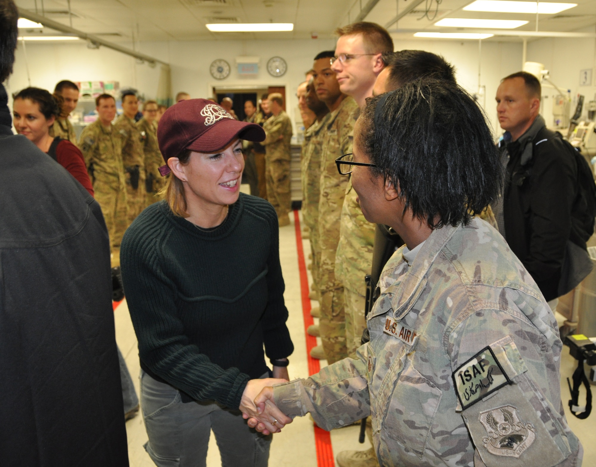 Mrs. Stephanie Carter, wife of U.S. Deputy Secretary of Defense Mr. Ashton Carter, greets an emergency room staff member from the Heathe N. Craig Joint Theater Hospital during a Thanksgiving day visit at Bagram Airfield, Afghanistan, Nov. 28, 2013. (U.S. Air Force Photo/Tech. Sgt. Rob Hazelett)