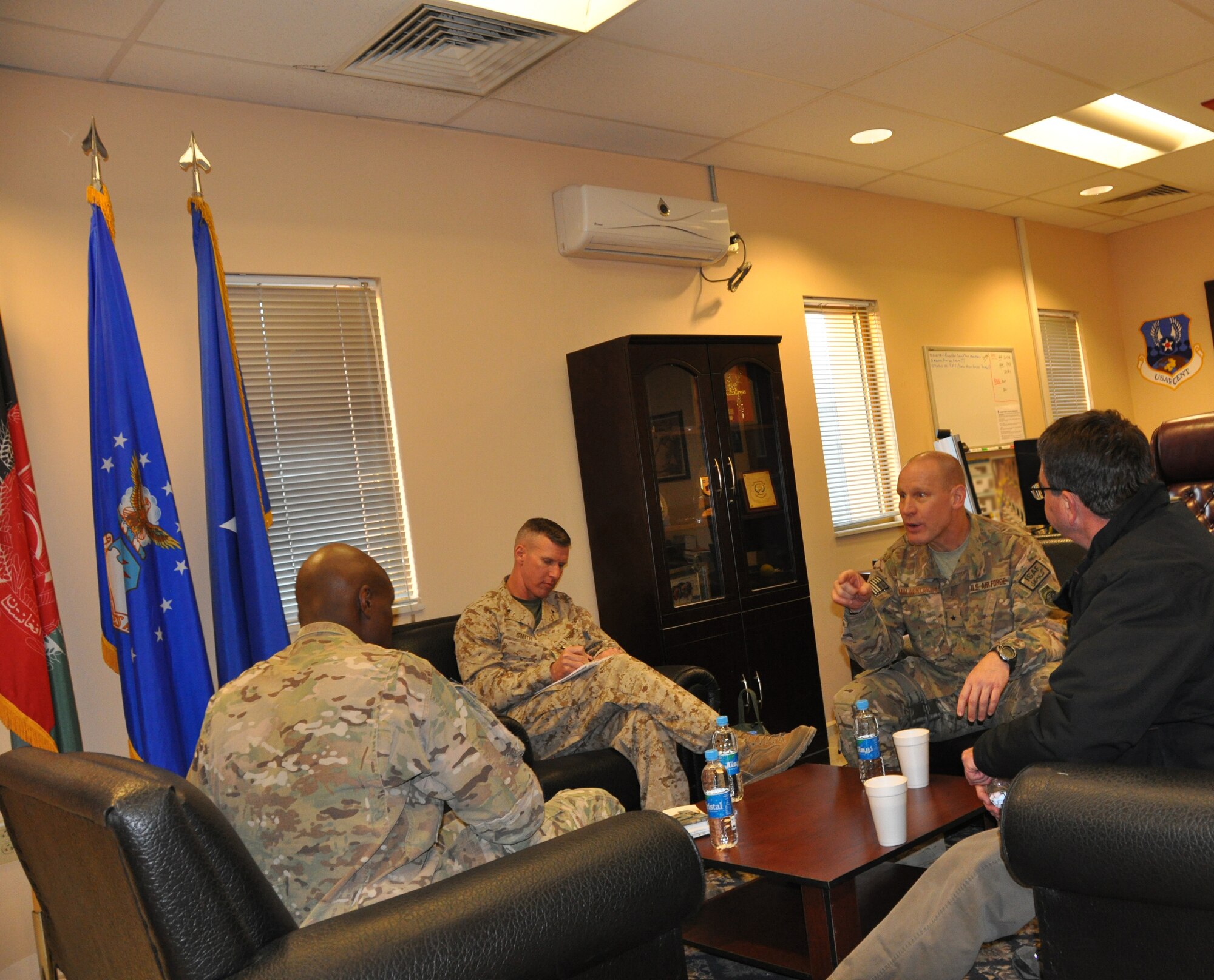 Brig. Gen. Patrick Malackowski, 455th Air Expeditionary Wing commander, holds a discussion during a Thanksgiving day visit that included Mr. Ashton Carter, U.S. Deputy Secretary of Defense, at Bagram Airfield, Afghanistan, Nov. 28, 2013. (U.S. Air Force Photo/Tech. Sgt. Rob Hazelett)
