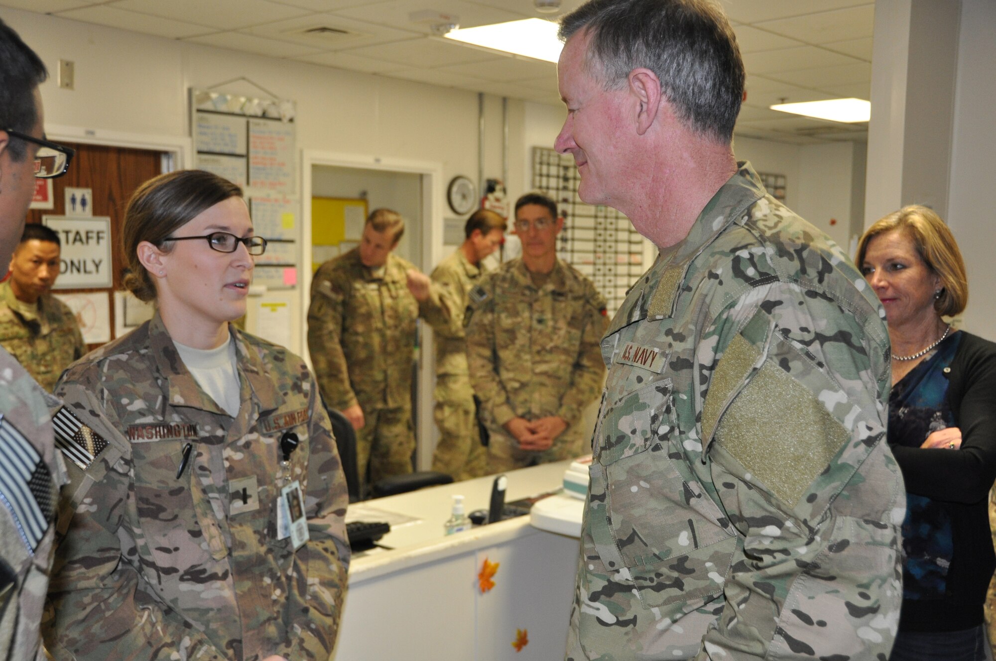 Admiral William H. McRaven, commander, Special Operations Command, and his wife Georgeann McRaven, listen to a hospital staff member from the Heathe N. Craig Joint Theater Hospital during a Thanksgiving day visit at Bagram Airfield, Afghanistan, Nov. 28, 2013. (U.S. Air Force Photo/Tech. Sgt. Rob Hazelett)