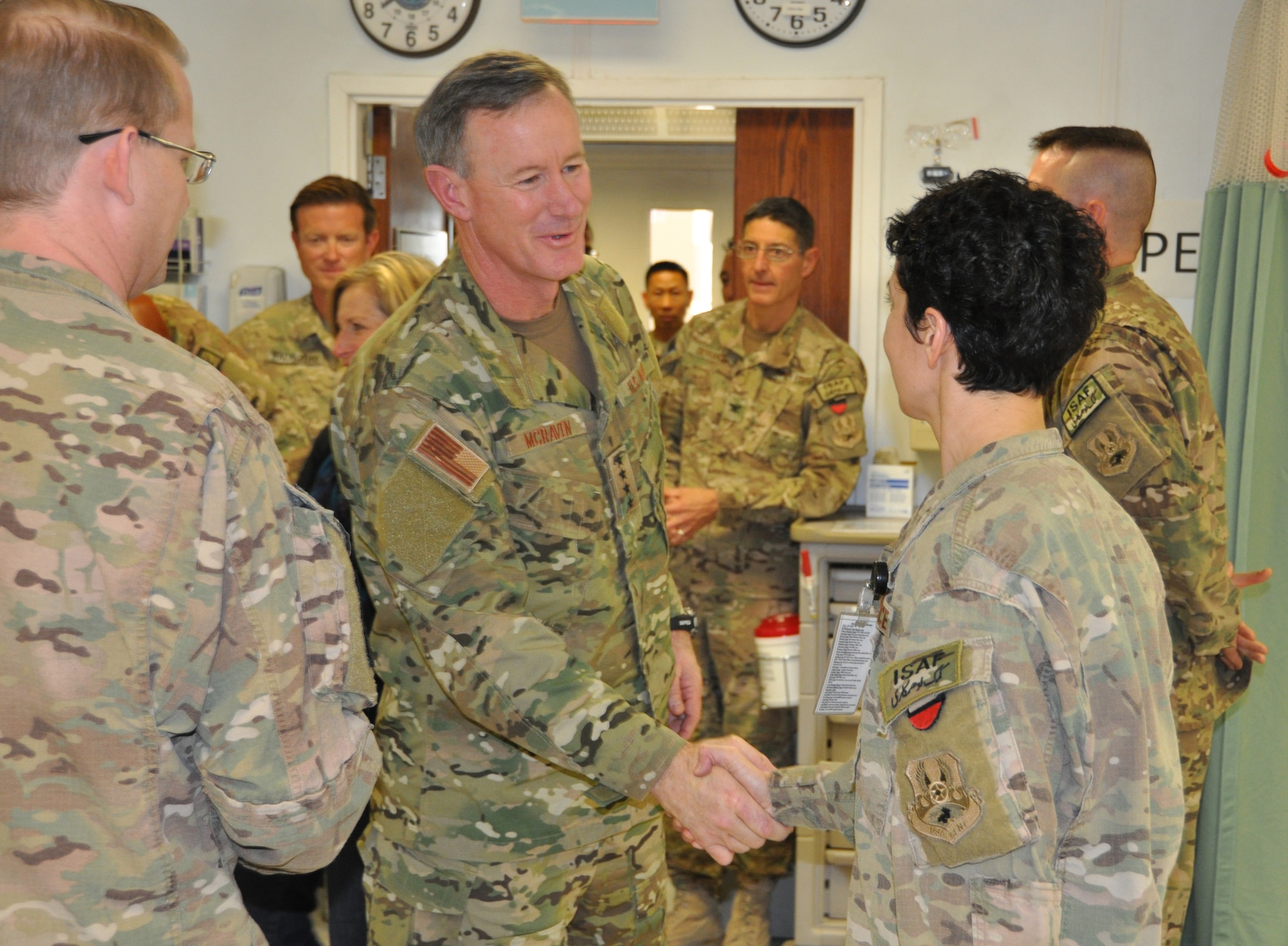 Admiral William H. McRaven, commander, Special Operations Command, greets an emergency room staff member at the Heathe N. Craig Joint Theater Hospital during a Thanksgiving day visit at Bagram Airfield, Afghanistan, Nov. 28, 2013. (U.S. Air Force Photo/Tech. Sgt. Rob Hazelett)