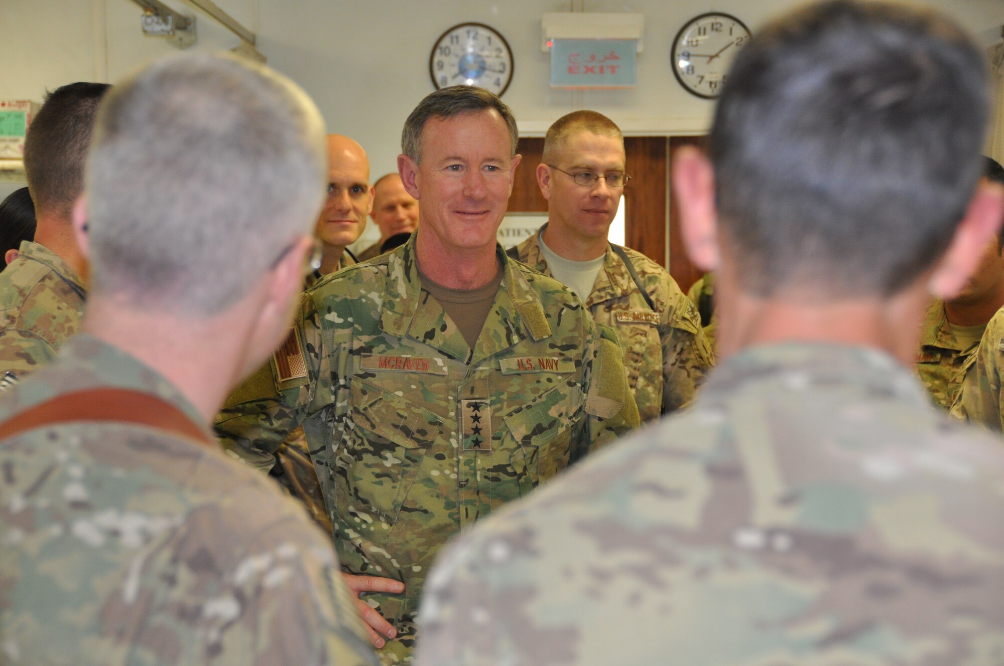 Admiral William H. McRaven, commander, Special Operations Command, listens to emergency room staff members from the Heathe N. Craig Joint Theater Hospital during a Thanksgiving day visit at Bagram Airfield, Afghanistan, Nov. 28, 2013. (U.S. Air Force Photo/Tech. Sgt. Rob Hazelett)