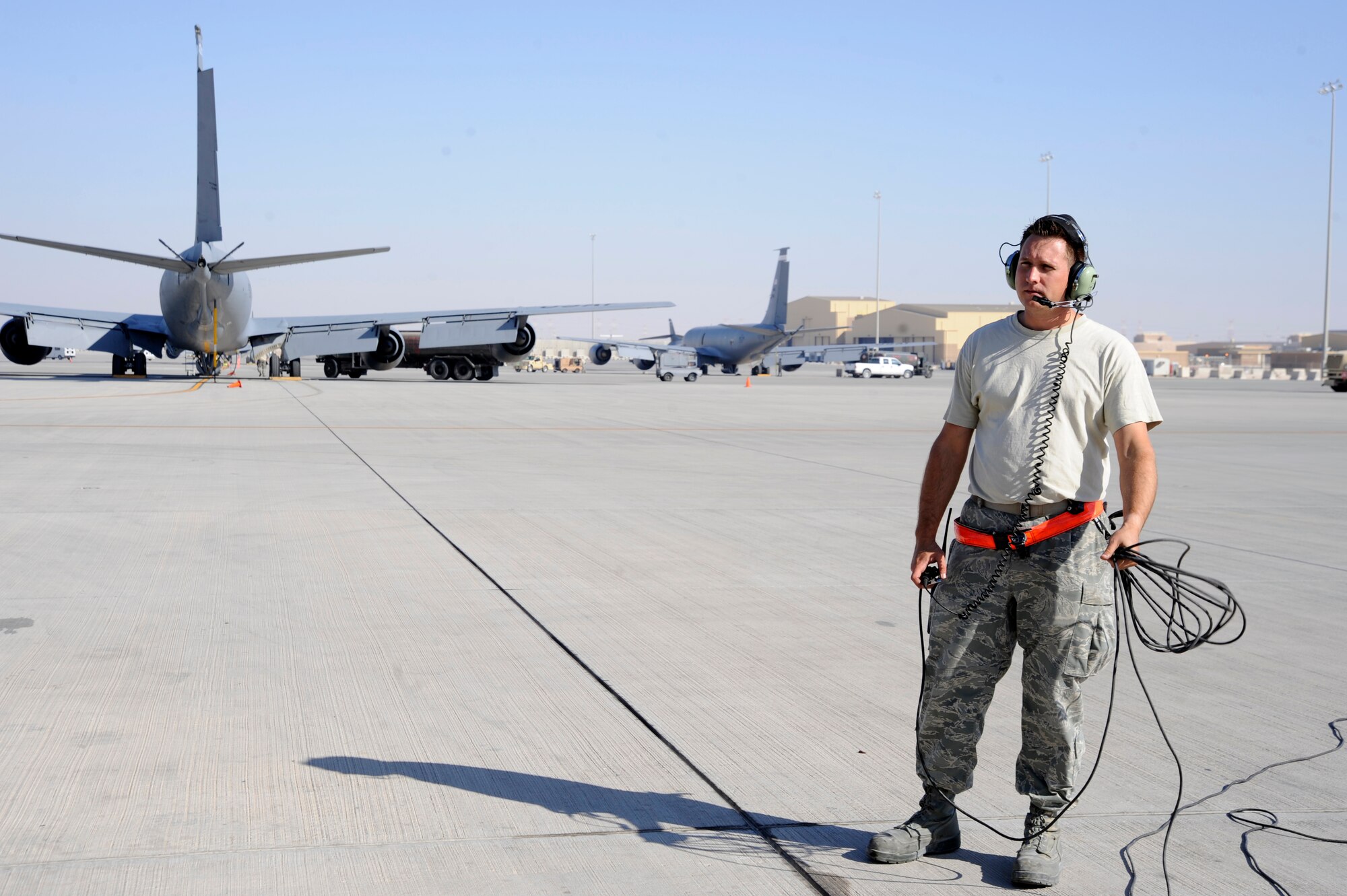Tech. Sgt. Ric Connell establishes communication with a maintainer inside a KC-135 Stratotanker performing an operations check after a reinstallation of a nose wheel at the 379th Air Expeditionary Wing in Southwest Asia, Nov. 26, 2013. The 379th Expeditionary Maintenance Squadron Aero Repair Shop performs heavy maintenance on major components of all aircraft assigned to the 379th AEW. Connell is a 379th EMXS AR shop repair and reclamation craftsman deployed from Offutt Air Force Base, Neb., and a Warner Robins, Ga., native. (U.S. Air Force photo/Senior Airman Bahja J. Jones)  
