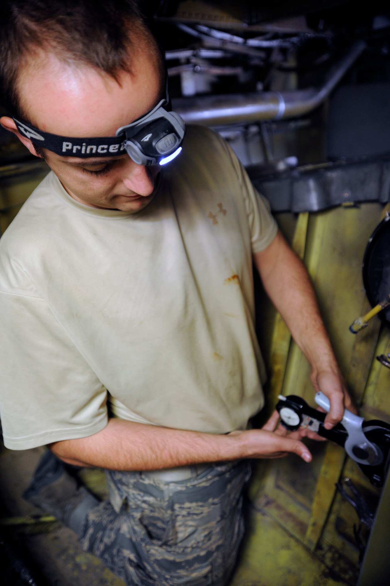 Staff Sgt. Jonathan Adams rigs security cables, which control the nose landing gear on the KC-135 Stratotanker, during an operations check after reinstallation at the 379th Air Expeditionary Wing in Southwest Asia, Nov. 26, 2013. The 379th Expeditionary Maintenance Squadron Aero Repair Shop performs heavy maintenance on major components of all aircraft assigned to the 379th AEW. Adams is a 379th EMXS AR shop repair and reclamation craftsman deployed from March Air Force Base, Calif., and hails from Riverside, Calif. (U.S. Air Force photo/Senior Airman Bahja J. Jones)  