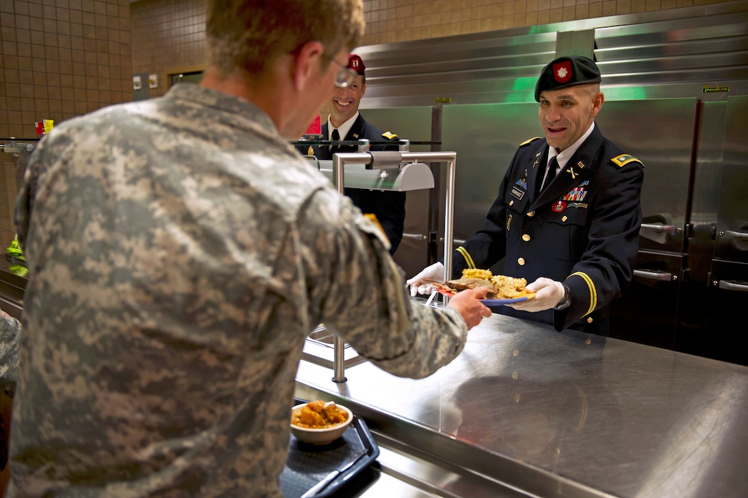 Army senior leaders assigned to 7th Special Forces Group serve Thanksgiving lunch to soldiers at the dining facility on Eglin Air Force Base, Fla., Nov. 26, 2013.