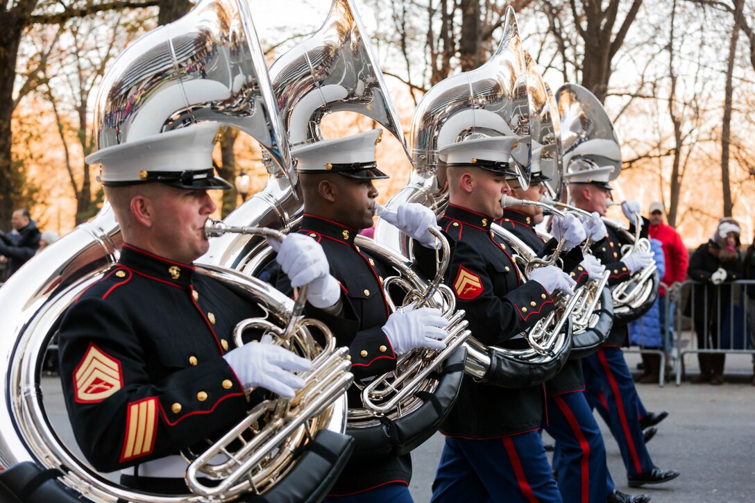 The East Coast Marine Corps Combined Band, which includes a tuba section, marches  2.5 miles in Macy's Thanksgiving Day Parade in New York, Nov. 28, 2013.