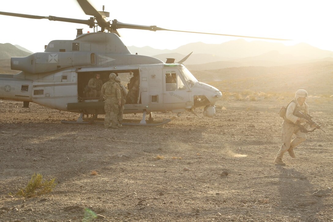 A Marine with Combat Logistics Battalion 7 dismounts a UH-1Y Huey helicopter after a simulated casualty evacuation during a Combat Logistics Patrol in the Combat Center’s Lava Lake training corridor, Nov. 15, 2013.


