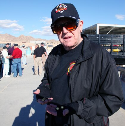Michael Glover of Apple Valley, who served in the Marine Corps from 1960 to 1964, shows off two pairs of brass pellets he received during the High Desert Marines' visit to the Range Sustainment Branch while touring the Combat Center on Nov. 20, 2013. The second pair will go to his son, who works at the U.S. Army's National Training Center at Fort Irwin.