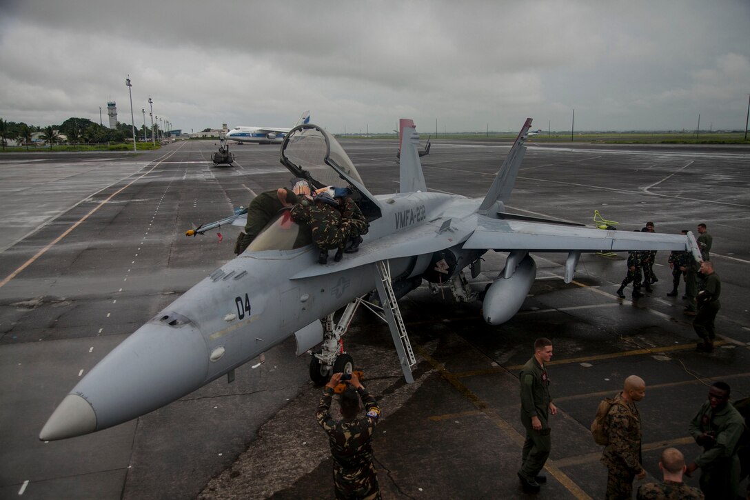 Philippine and U.S. Marines conduct aircraft rescue and firefighting training at Clark Air Field, Pampanga, Republic of the Philippines, Sept. 26 during Amphibious Landing Exercise 2014. Bilateral training during PHIBLEX 14 ensures Philippine and U.S. forces are capable of integrating effectively to conduct humanitarian assistance and regional security missions. The day of training familiarized the Armed Forces of the Philippines members with U.S. egress procedures should an aircraft mishap incident occur. The U.S. Marines are with Marine Wing Support Squadron 172, Marine Wing Support Group 17, 1st Marine Aircraft Wing, III Marine Expeditionary Force. 