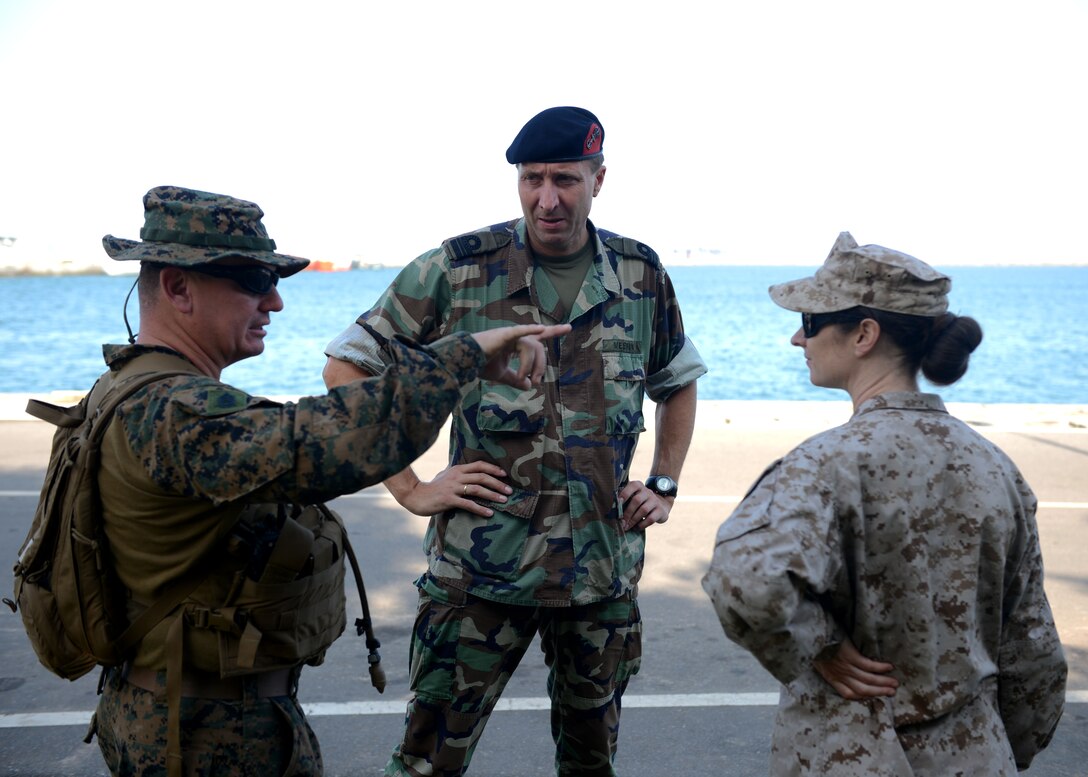 U.S. Marine Corps Gunnery Sgt. William Schaefer, left, Royal Marine Corps Netherlands Major Theo Mestrini, center, and U.S. Marine Corps Capt. Laura Perazzola discuss amphibious operations and planning as part of Africa Partnership Station. Embarked International Marine Task Force are in Ghana to support Africa Partnership Station, an international security cooperation initiative facilitated by Commander, U.S. Naval Forces Europe-Africa, aimed at strengthening global maritime partnerships through training and collaborative activities in order to improve maritime safety and security in Africa. 