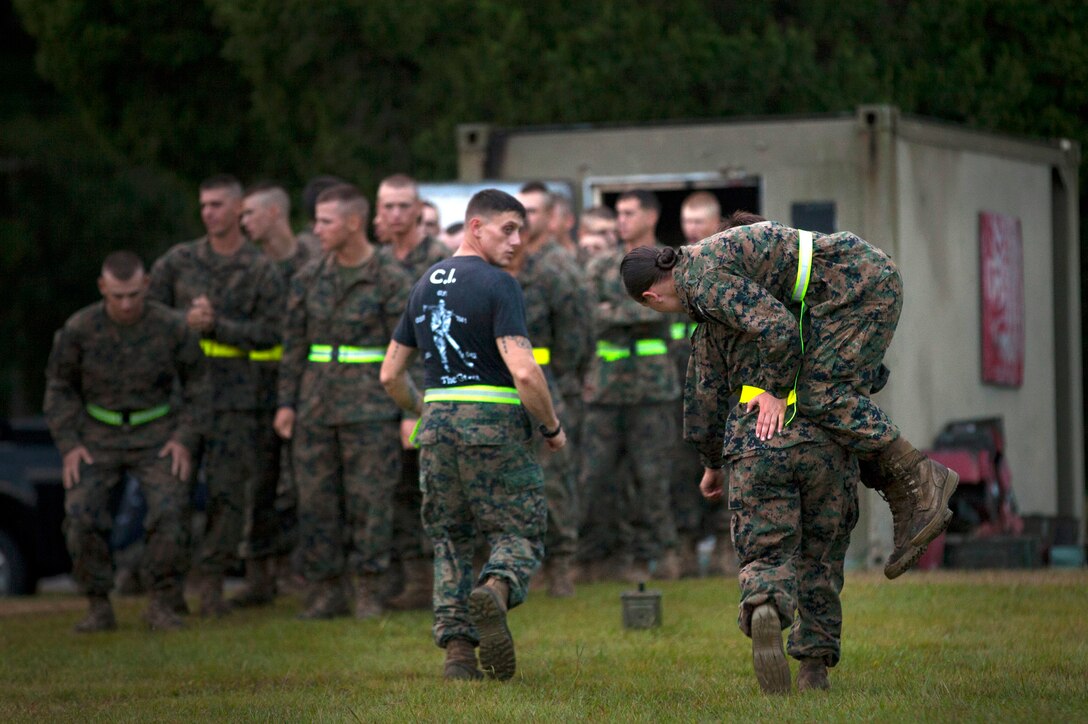 A female student at the Infantry Training Battalion buddy carries another female student during the movement-under-fire portion of the Combat Fitness Test at Marine Corps Base Camp Geiger, N.C., Sept. 26, 2013. Fifteen female Marines, just graduated from basic training, became the first women to attend the ITB course this week as part of ongoing research into opening combat-related job fields to women. The female Marines are expected to uphold ITB fitness standards to continue in the course, but will not receive the 0311 infantry occupational-specialty upon graduation. (U.S. Marine Corps photo by Cpl. Chelsea Flowers Anderson/Released)