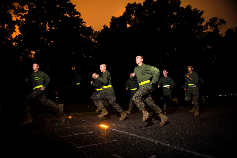 Infatry Training Battalion students with Delta Co. run the movement to contact portion of the Combat Fitness Test during their first week of training at Camp Geiger, N.C, Sept. 26, 2013. The students must pass the ITB standard for the physical fitness test and CFT to continue on in the course. The students are part of the first ITB company to include female Marines as part of ongoing research into opening combat-related job fields to women. (U.S. Marine Corps photo by Sgt. Tyler L. Main/Released)