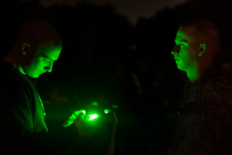 A student at the Infantry Training Battalion records his time with an instructor after completing the movement to contact portion of the Combat Fitness Test at Camp Geiger, N.C., Sept. 26, 2013. The students must pass the ITB standards for the physical fitness test and the CFT to continue on in the course. The students are part of the first ITB company to include female Marines as part of ongoing research into opening combat-related job fields to women. (U.S. Marine Corps photo by Sgt. Tyler L. Main/Released)