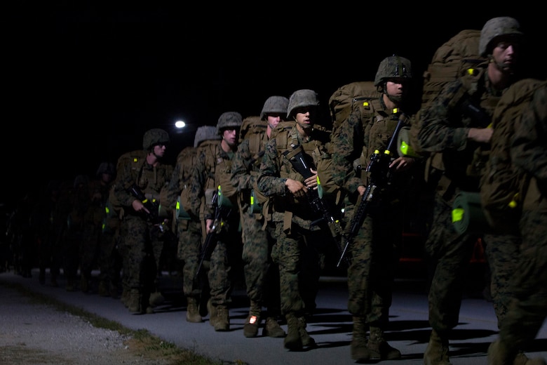 Students at the Infantry Training Battalion carry packs on a 5-kilometer hike during their first week of training at Marine Corps Base Camp Geiger, N.C., Sept. 28, 2013. The students will complete 10-kilometer, 15-kilometer and 20-kilometer hikes throughout their training iteration. Fifteen female Marines were given the opportunity to attend the training after boot camp for the first time in Marine Corps history as part of ongoing research into the acceptance of women into combat-related job fields. The female Marines go through the same training and are held to the same ITB standards as their male counterparts. (U.S. Marine Corps photo by Cpl. Chelsea Flowers Anderson/Released)