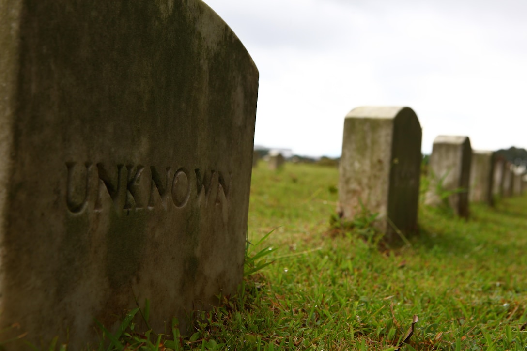 An unknown headstone marks the gravesite of a fallen service member at the Clark Veterans Cemetery, Clark, Pampanga, Republic of the Philippines. "Throughout the wars there have been lots of unknown graves filled with bodies of service members that have fallen; however, even though we might not know their names, it is imperative that they are remembered and honored," said Navy Lt. Stephen F. Brown, chaplain for 3d Marine Expeditionary Brigade, III Marine Expeditionary Force. "That could have been any of us, and as service members we should give the love that we would like to receive if it was us." Brown is in the Philippines conducting Amphibious Landing Exercise 2014. PHIBLEX 14 is an exercise designed to improve Philippine-U.S. interoperability, increase readiness, and enhance the ability for a bilateral force to respond to natural disasters or other regional contingencies. (U.S. Marine Corps photo by Lance Cpl. Jose D. Lujano/ Released)