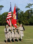 A Marine Corps color guard marches with the American flag alongside the Marine Corps and Navy flags during a change of command ceremony aboard Camp Lejeune, N.C., Sept. 30, 2013. Navy Capt. Cameron Waggoner, the outgoing commanding officer for 2nd Medical Battalion, Combat Logistics Regiment 25, 2nd Marine logistics Group relinquished command to Navy Capt. Michael Sokolowski. (U.S. Marine Corps photo by Lance Cpl. Shawn Valosin)
