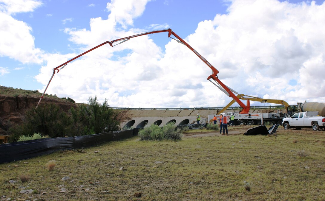 GALISTEO DAM, N.M., -- Recent work by the Bureau of Reclamation and the District saved the dam's access road. Monsoonal rains had brought debris downsteam, choking the culvert and threatening the road.