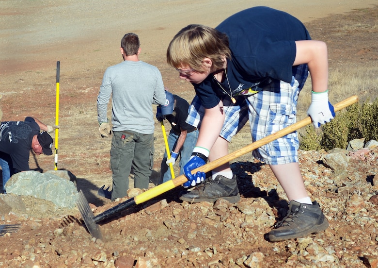 Boy Scouts with Troop 352 of Valley Springs, Calif., help build a trail during National Public Lands Day, Sept. 28, 2013, at New Hogan Lake, the U.S. Army Corps of Engineers Sacramento District park near Valley Springs. (U.S. Army photo by Robert Kidd/Released)