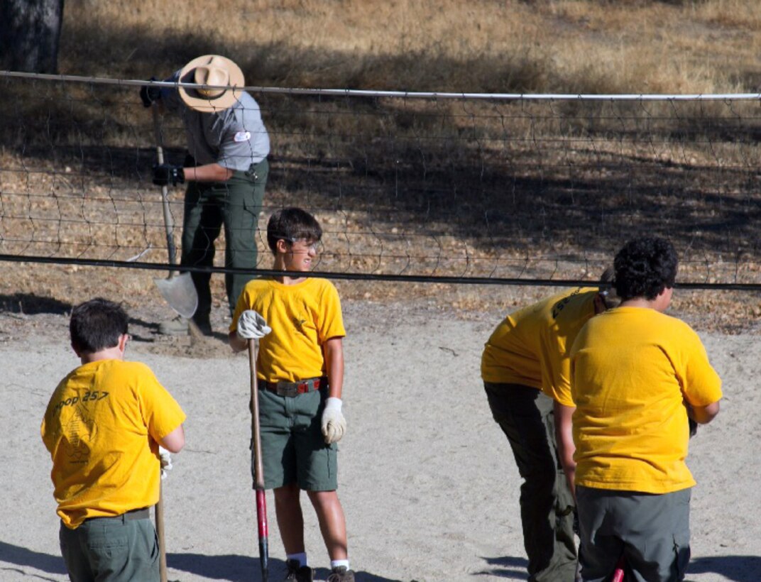 Boy Scouts with Troop 257, Clovis, Calif., help condition the sand volleyball court at Hensley Lake, the U.S. Army Corps of Engineers Sacramento District park near Raymond, Calif., during National Public Lands Day, Sept. 28, 2013. (U.S. Army photo by Sharon Anderson/Released)