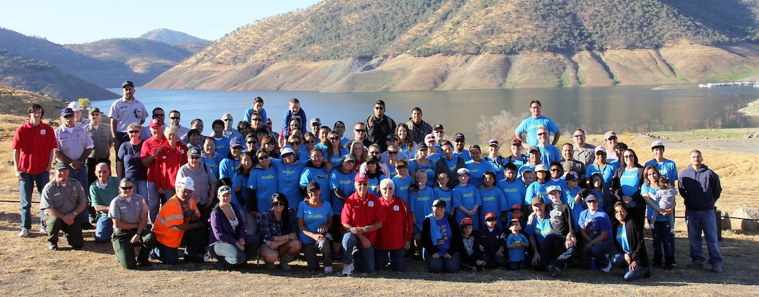 Volunteers smile for the camera before heading out to work on a host of projects during National Public Lands Day, Sept. 28, 2013, at Pine Flat Lake near Piedra, Calif. Pine Flat Lake is operated by the U.S. Army Corps of Engineers Sacramento District. (U.S. Army photo by Lucy Vang/Released)