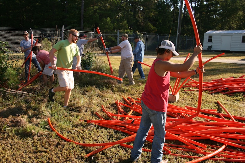 CLARKS HILL, S.C. -- Volunteers from Georgia Southern University build fish attractors using orange piping and cinder blocks on National Public Lands Day, Sept. 28, 2013. The fish attractors will be submerged in the U.S. Army Corps of Engineers J. Strom Thurmond Lake to provide cover for fish and enhance habitat.