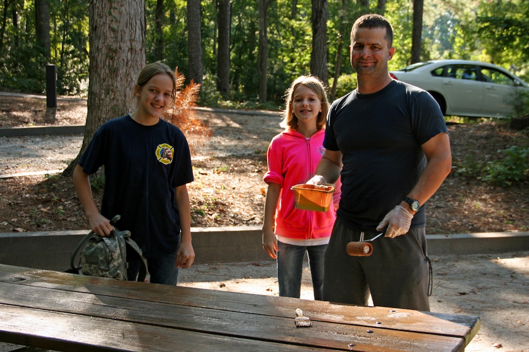 CLARKS HILL, S.C. -- Volunteers apply water sealant on picnic tables at the U.S. Army Corps of Engineers J. Strom Thurmond Lake on National Public Lands Day, Sept. 28, 2013.