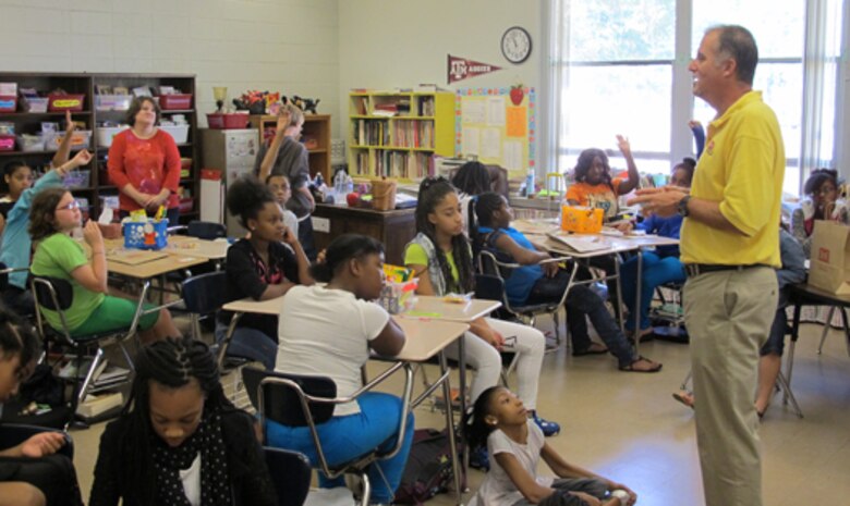 Pat Haas, Huntsville Center civil engineer and director of Chemical Demilitarization Directorate, engages students during a STEM discussion at Chapman Middle School Sept. 27.