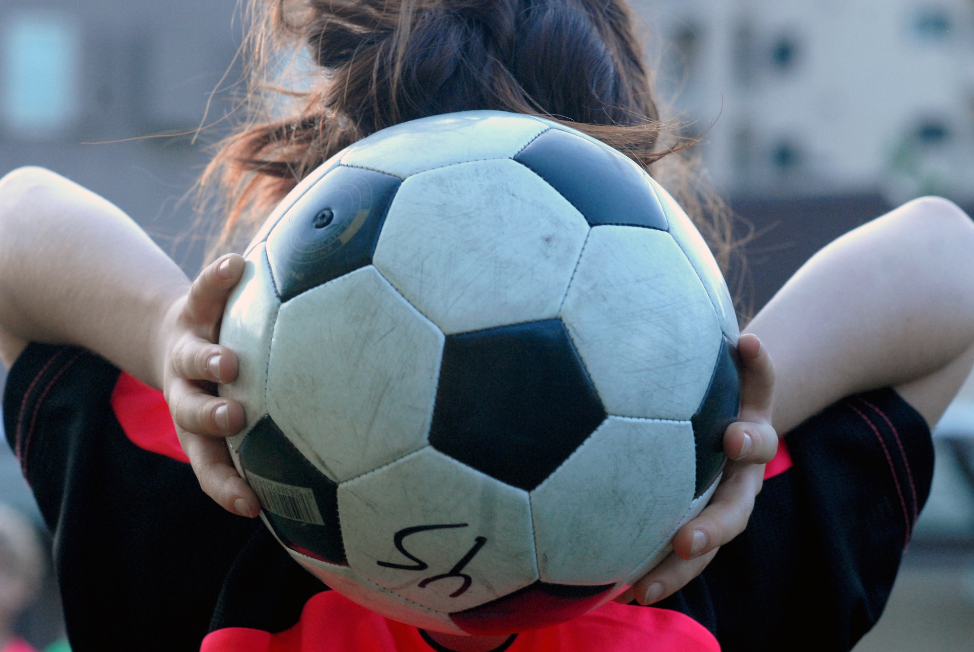A member of the Crushers, from the age 5-6 division of youth soccer, prepares to throw a soccer ball inbounds during a youth soccer match at Osan Air Base, Republic of Korea, Sept. 25, 2013. Youth sports are made possible by dedicated volunteer coaches from the base community. If interested in volunteering for seasonal youth sports, contact the director of youth sports by emailing matthew.sharman@us.af.mil. (U.S. Air Force photo/1st Lt. Kay M. Nissen)